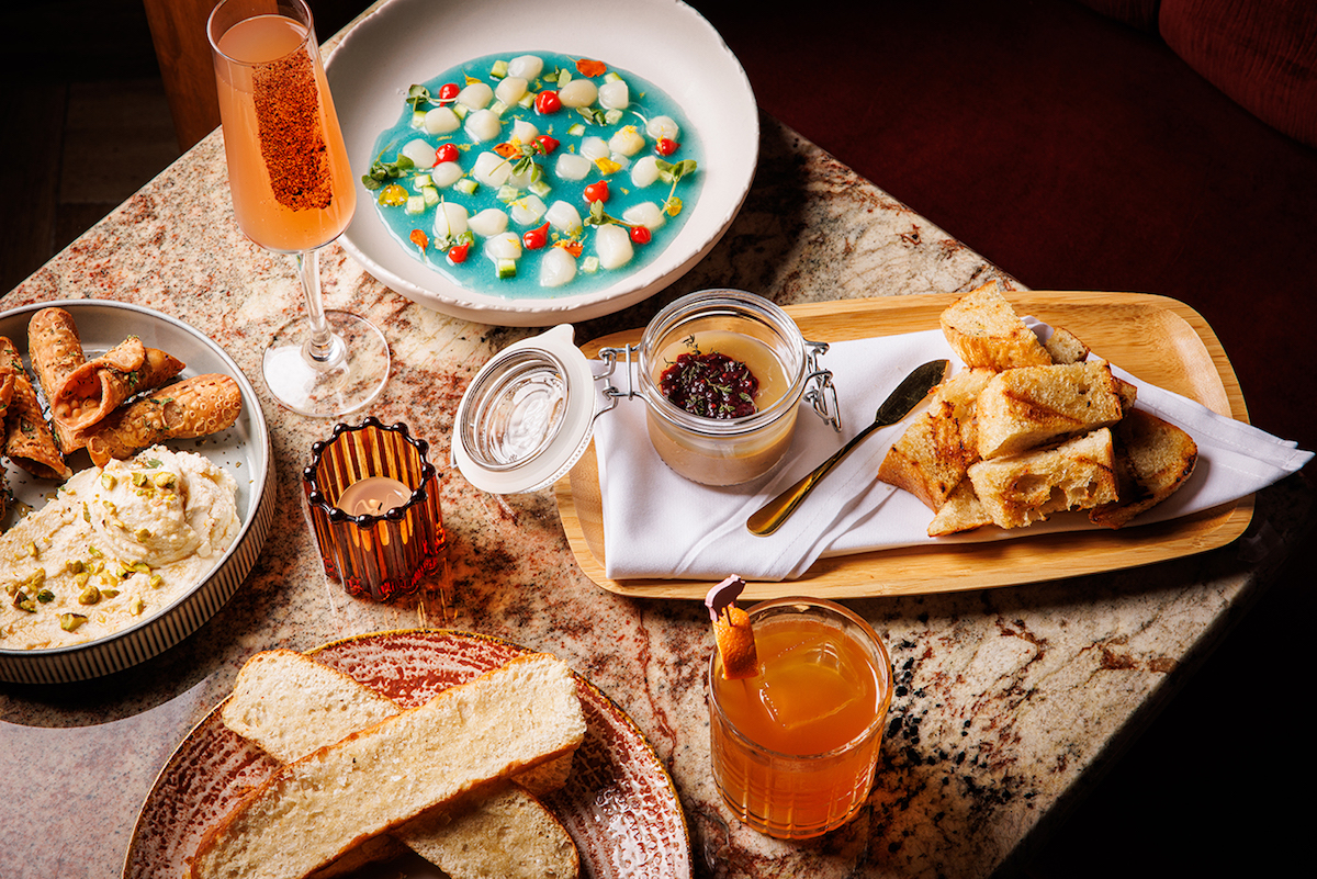 The faux gras, scallop crudo, and cannoli dip with cocktails at Flamant. | Photo by Samantha Marie