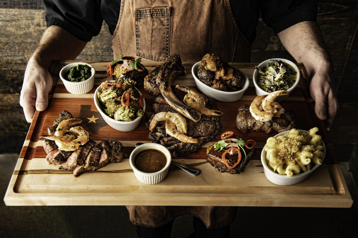 HWTR_cowboy feast_in hands 1 - DiningOut Dallas The cowboy feast at Haywire. | Photo by Haywire