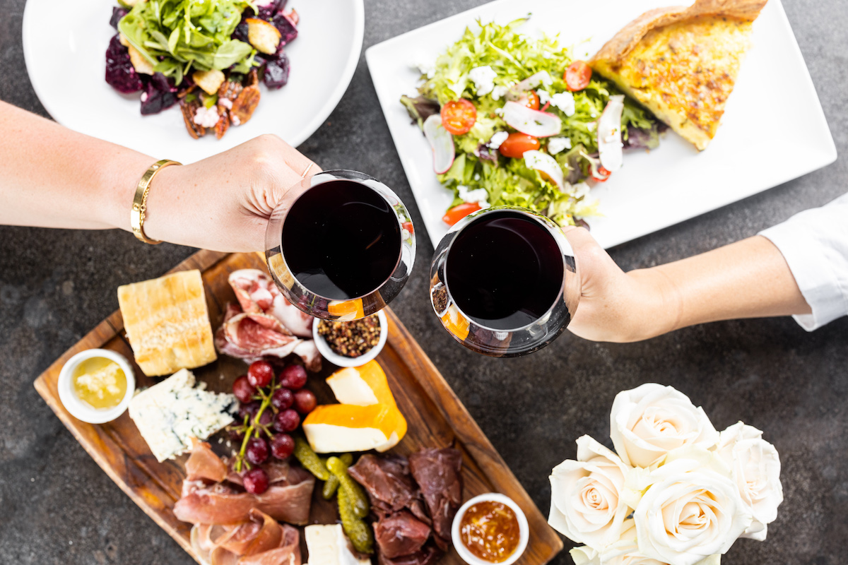 Mercat Bistro Food Wine1jpg Harwood Hospitality Group - DiningOut Dallas A happy hour wine toast at Mercat Bistro. | Photo by Harwood Hospitality Group