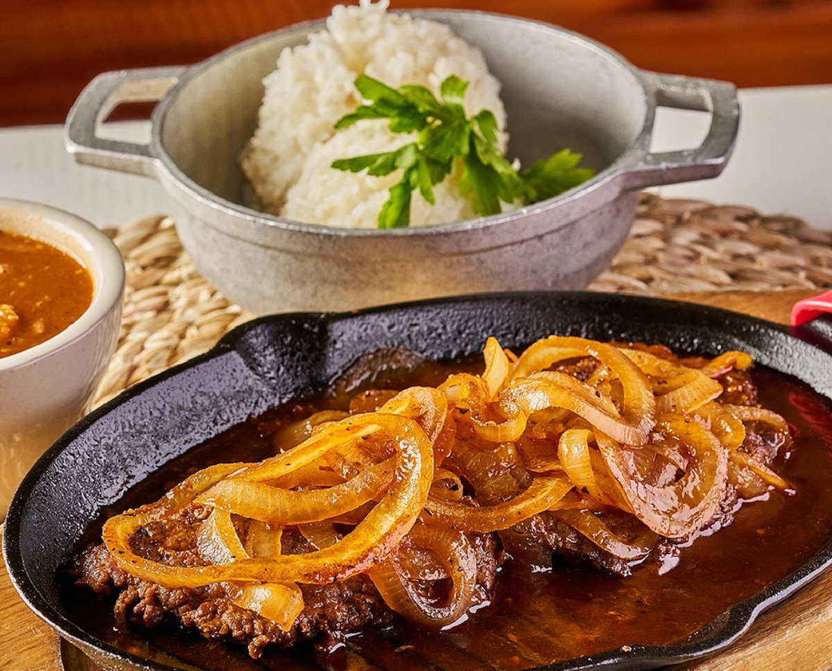 Screenshot 2025-07-22 at 25517 PM - DiningOut Dallas Steak and onions with white rice at Doña Maria. | Photo by Doña Maria