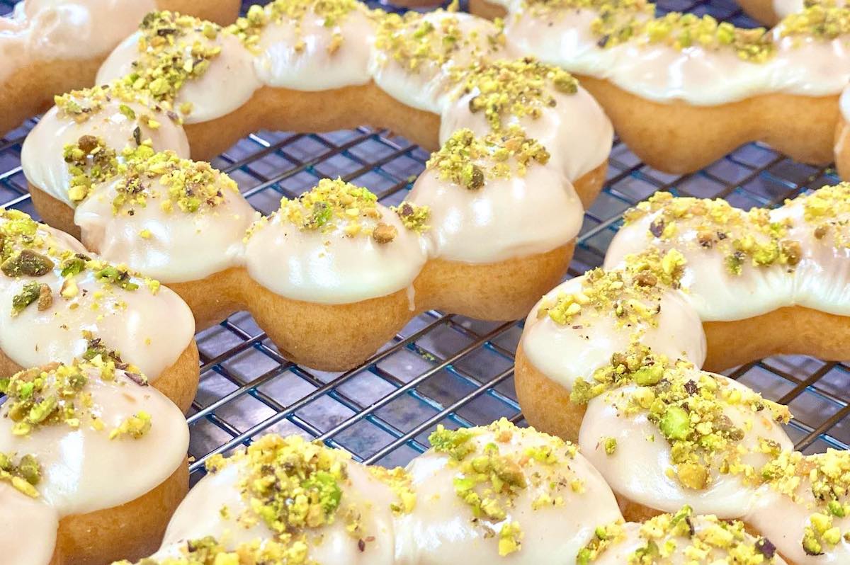 Mochio - DiningOut Dallas Mochio's signature rings iced and topped with pistachio. | Photo by Mochio Mochi Donut