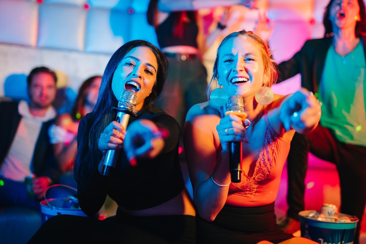 A duo sings to the crowd at City Night KTV. | Photo by City Night KTV