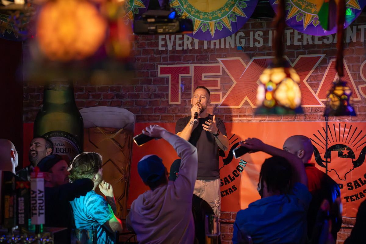 A performer takes the stage for karaoke at the Round Up Saloon. | Photo by the Round Up Saloon