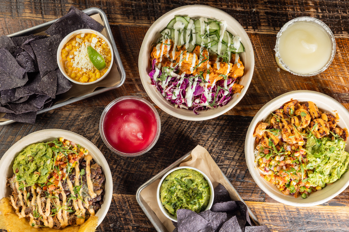 A variety of bowls, chips and dip, and frozen cocktails at Velvet Taco. | Photo by Velvet Taco