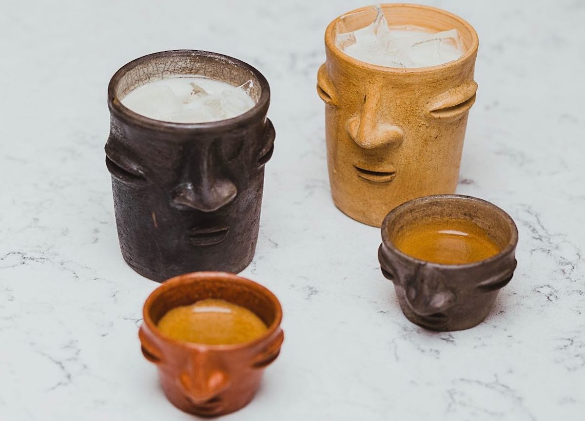 Coffee drinks in Oaxacan clay face mugs at Xamán Café. | Photo by Xamán Café