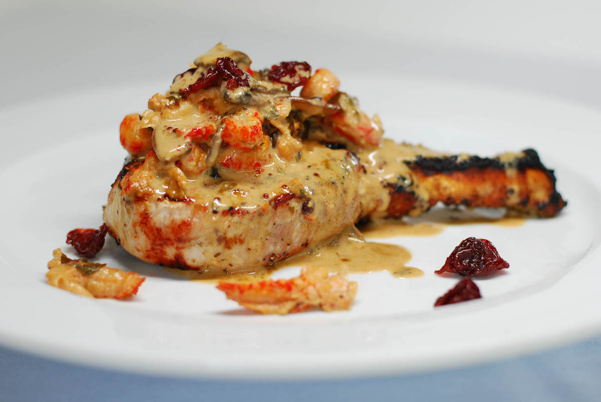 pork-chop-cognac-sour-cherries - DiningOut Dallas Pork chop with cognac and sour cherries at Gorji. | Photo by Gorji